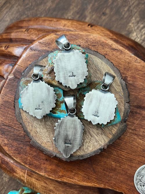 Handcrafted Sterling Silver and Burnt Spiny Oyster Shell Cluster Pendants by Loretta Delgarito