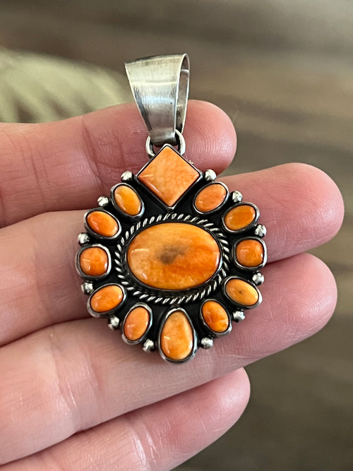 Handcrafted Sterling Silver and Burnt Spiny Oyster Shell Cluster Pendants by Loretta Delgarito