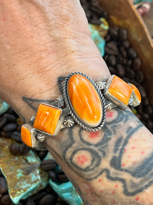 Handcrafted Sterling Silver and Orange Spiny Oyster Shell Geometric Row Cuff by Rosella Paxson