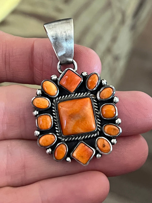 Handcrafted Sterling Silver and Burnt Spiny Oyster Shell Cluster Pendants by Loretta Delgarito