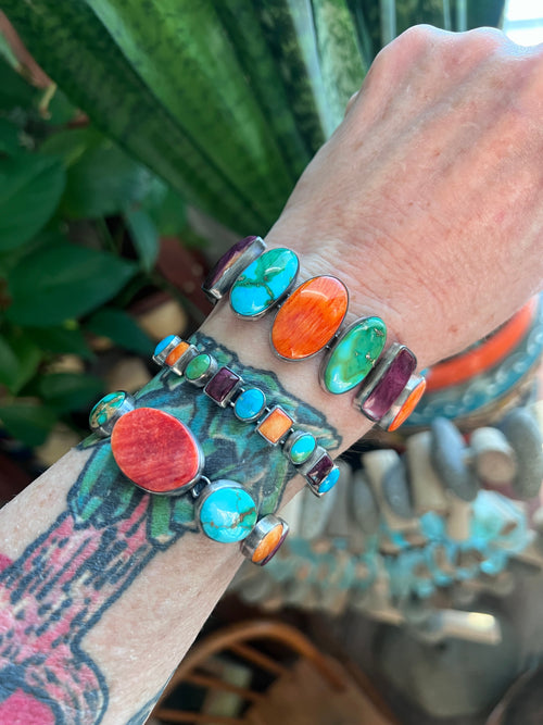 Loretta Delgarito Sterling Silver Electric Rainbow Link Turquoise and Spiny Oyster Bracelet: Ovals, Circles and Pears