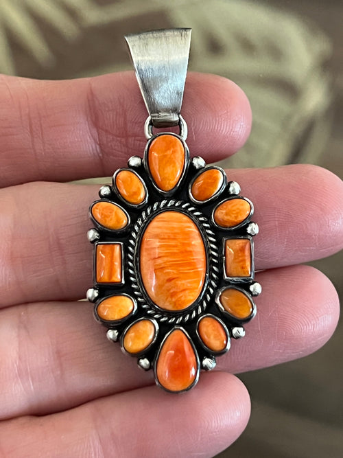 Handcrafted Sterling Silver and Burnt Spiny Oyster Shell Cluster Pendants by Loretta Delgarito