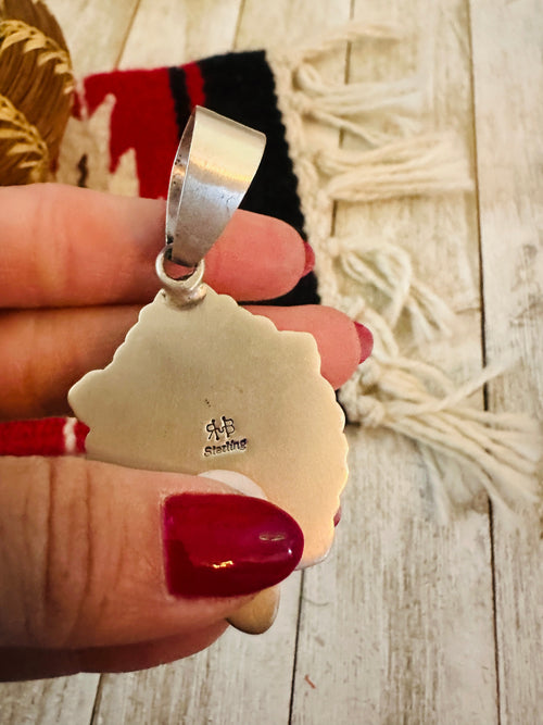 Handcrafted Sterling Silver and Coral Liberty Coin Pendant by Randy Boyd