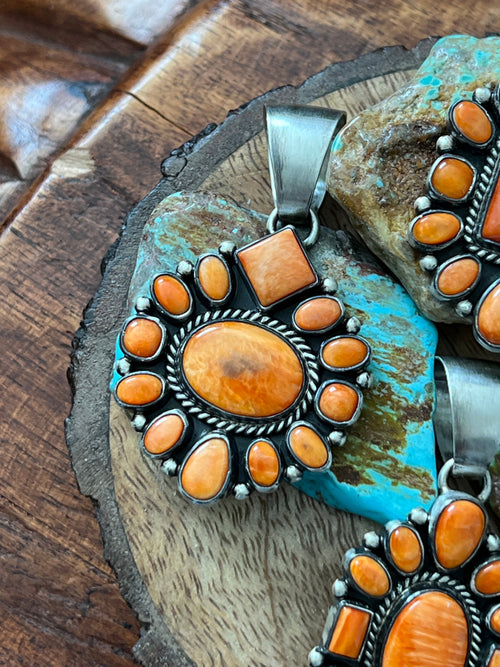 Handcrafted Sterling Silver and Burnt Spiny Oyster Shell Cluster Pendants by Loretta Delgarito