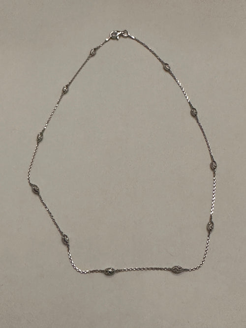 The Radiant Cascade Sterling Silver Diamond Cut Bead Necklace 16 Inch