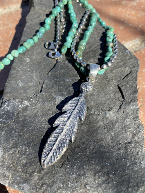 Navajo Sterling Silver Tufa Cast Feather