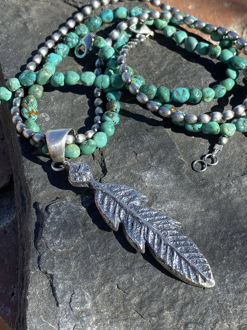 Navajo Sterling Silver Tufa Cast Feather